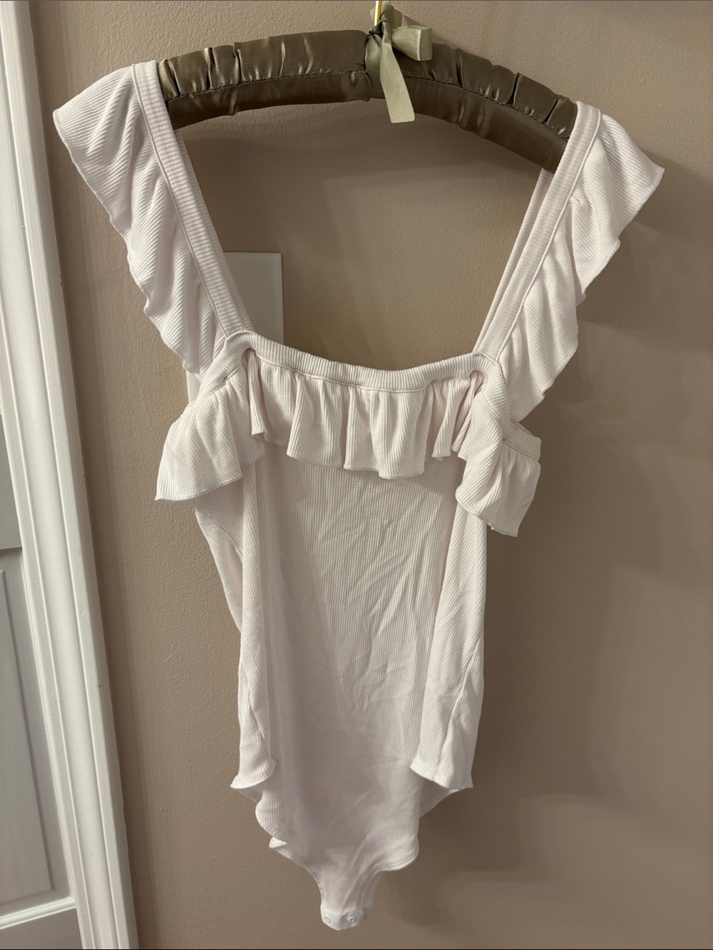 Ruffled One-Piece Bodysuit in White